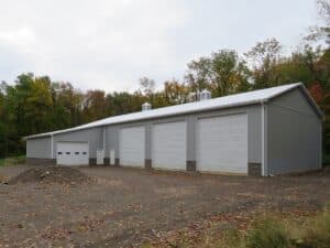 48x104x16 pole building with 1_ overhangs, Gray siding, Brite White roofing and trim_Sodus, NY